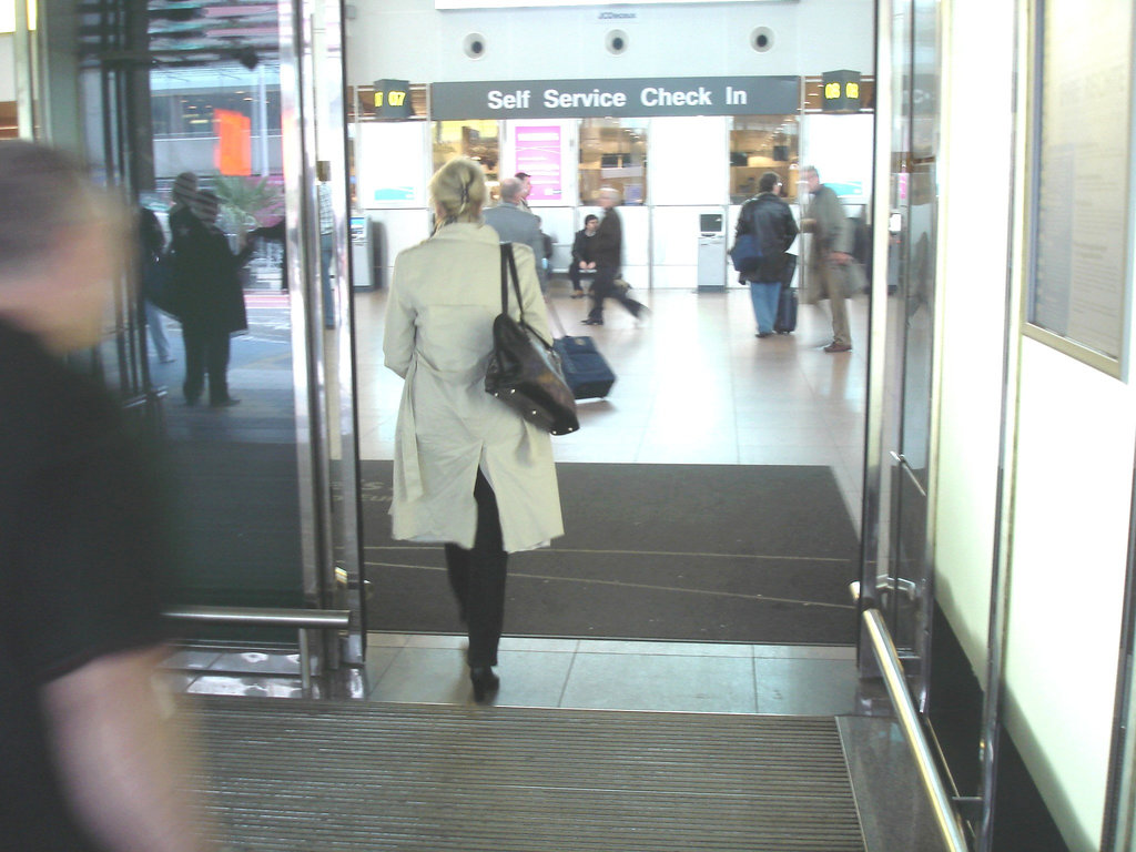 Heras blond mature in extreme hammer heeled boots -  Brussels airport -19-10-2008
